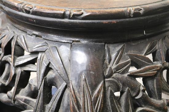 A Chinese carved hardwood marble inset jardiniere stand W.35cm